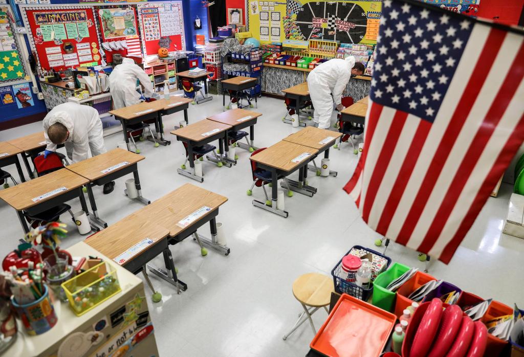 Schools abandon classes, states retreat as COVID-19 cases
surge across nation 1