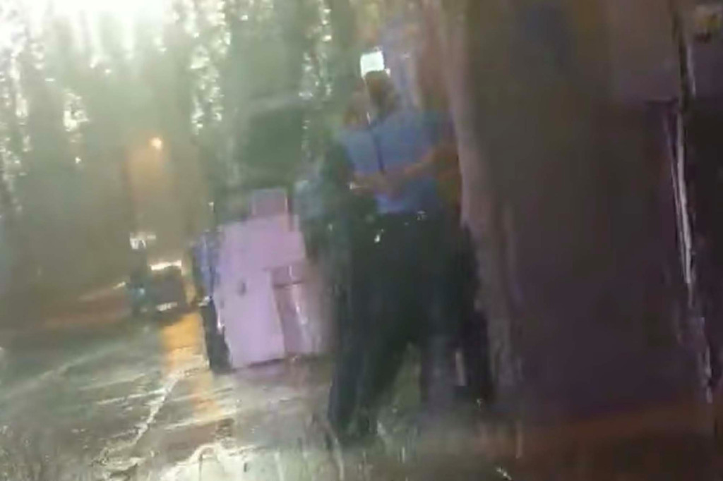 Michigan cop on leave after video shows officers pinning,
repeatedly hitting man 1