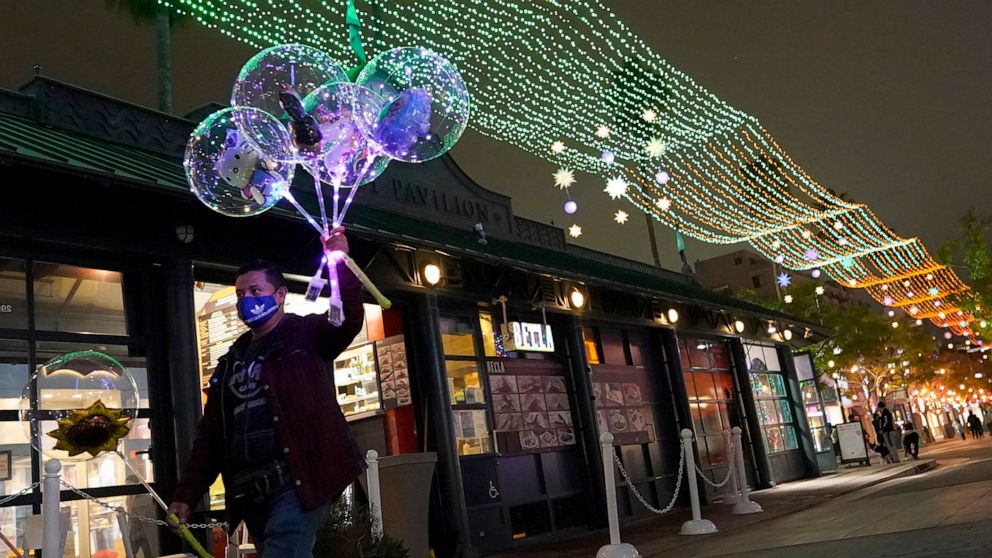 California enacts nighttime curfew as COVID-19 cases
spike 1