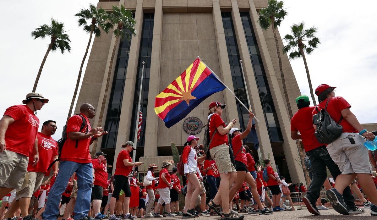 Arizona voters OK new tax on high earners to fund
schools 1