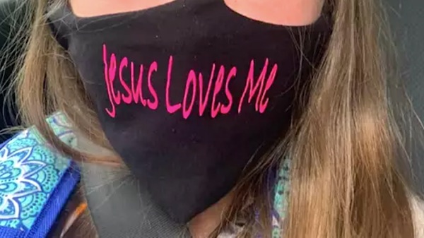 School policy changed to justify ban on 'Jesus Loves Me'
mask 1