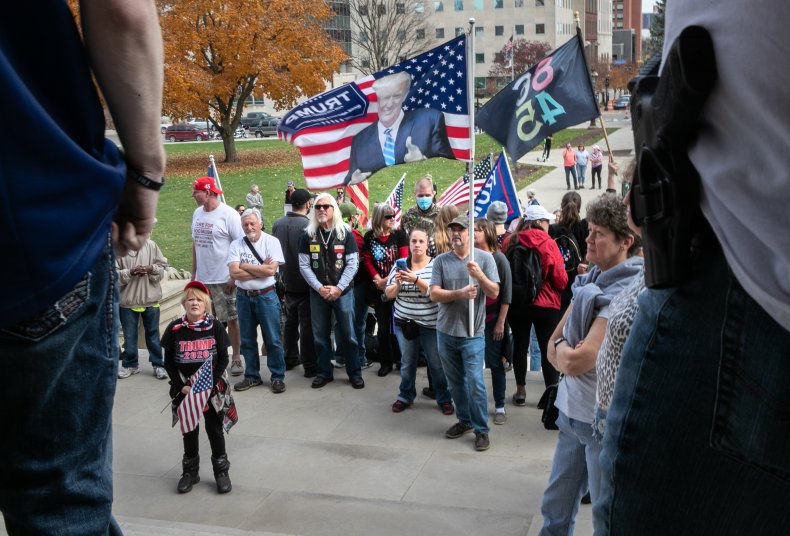 Trump Supporters Stand on BLM Mural During 'Stop the Steal'
Protest: 'We're Making a Statement' 1