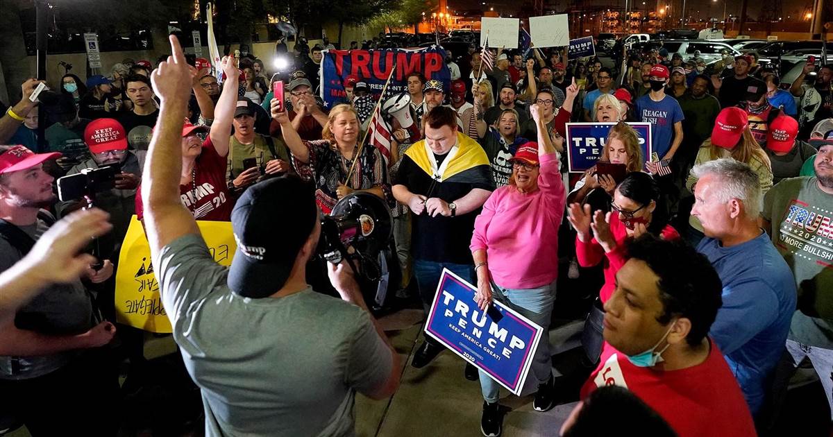 Tensions rise as protesters crowd outside of Phoenix
ballot-counting facility 1 Tensions rise as protesters crowd outside of Phoenix
ballot-counting facility 1