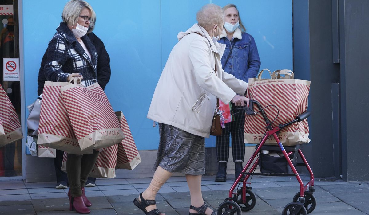 Pints poured, retail therapy: England readies for
lockdown 1