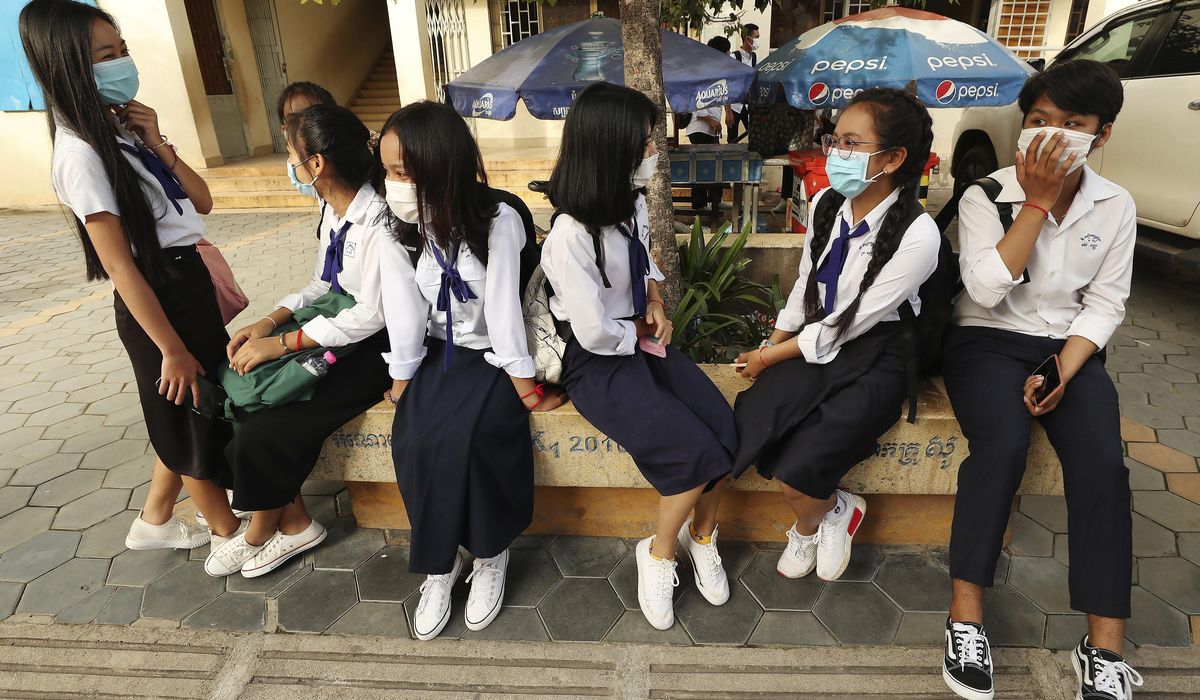 Cambodia shuts schools in capital area as virus
precaution 1