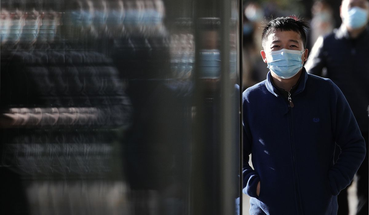 The Latest: WHO chief quarantines after contact is
infected 1
