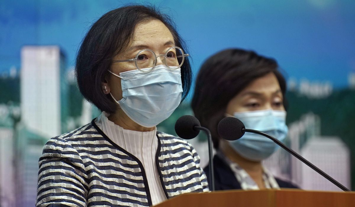 The Latest: Hong Kong to close more schools to fight
virus 1