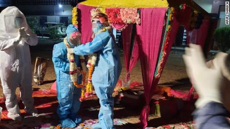 Couple weds in full PPE hours after bride tests positive for
Covid-19 1