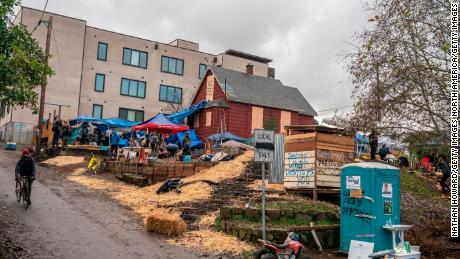 Tensions over eviction of Black-Indigenous family in
Portland reach boiling point as protesters clash with
police 1
