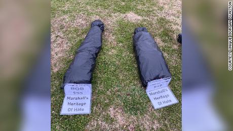 Group of Alabama protesters places fake body bags on
courthouse lawn to push for removal of Confederate flag and
monument 1
