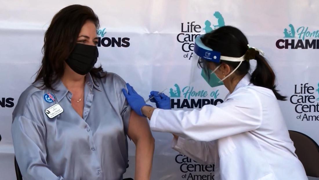 Staff at nursing home of coronavirus outbreak receive
vaccine 1