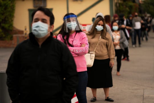 Coronavirus updates: UK vaccinations set to begin Tuesday;
Wyoming issues statewide mask mandate; Colorado's first gentleman
in hospital 1