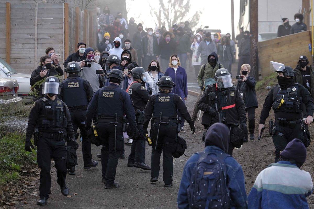 Portland police clash with protesters over foreclosure of
Black and Indigenous family 1 Portland police clash with protesters over foreclosure of
Black and Indigenous family 1