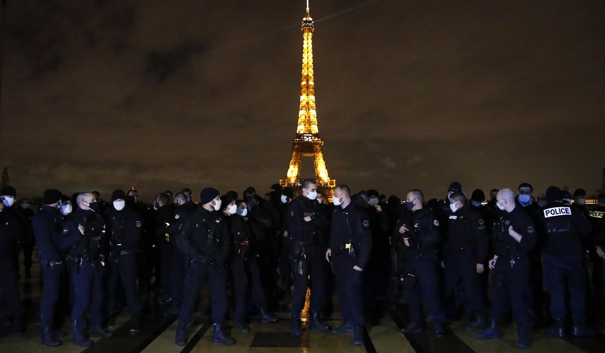 French police hold small but bold protest near Eiffel
Tower 1