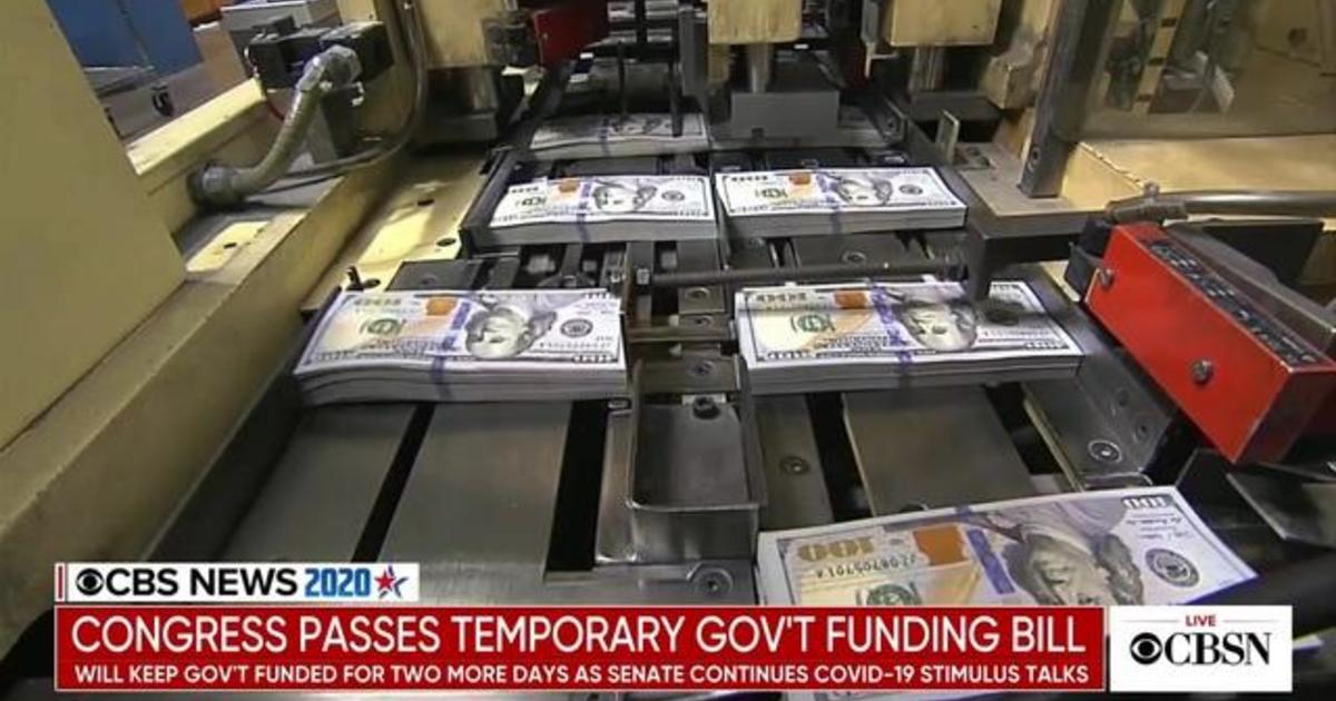 Congress passes temporary government funding to extend
coronavirus relief talks 1