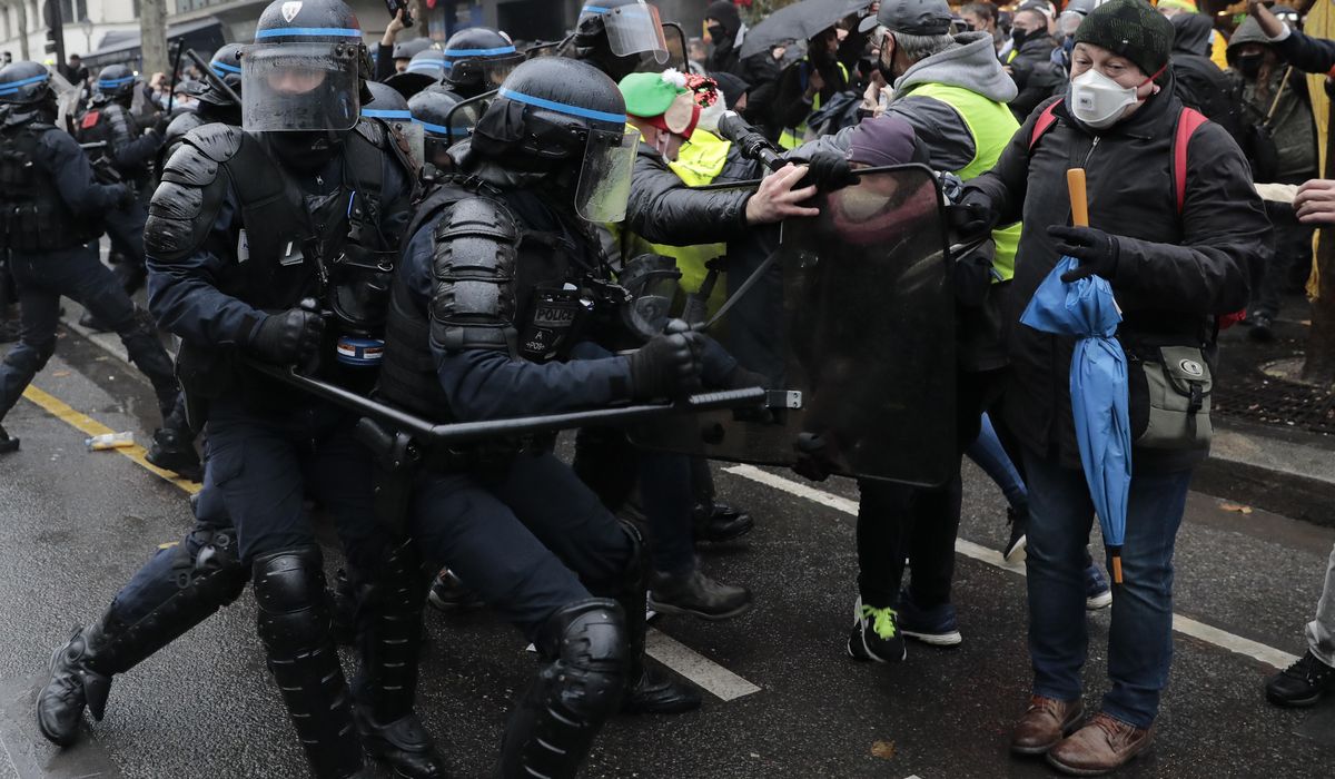 Dozens arrested at Paris protest over proposed security
law 1