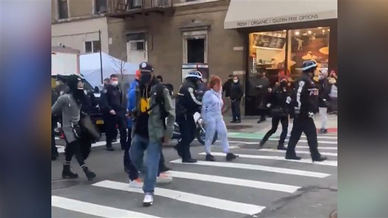 Driver arrested after plowing into New York City protesters,
injuring 6 1