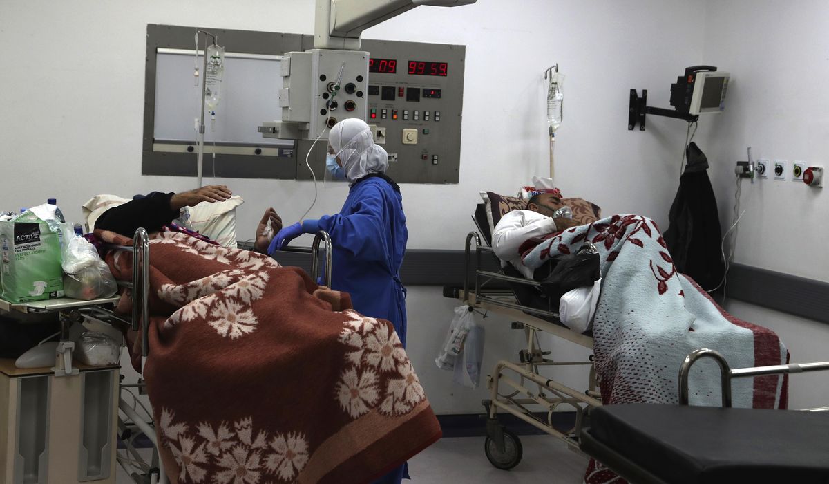 Lebanon surpasses record daily virus deaths amid
protests 1