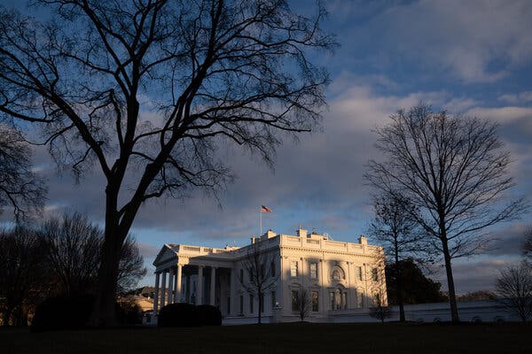 In Biden’s White House, Masks, Closed Doors and Empty
Halls 1