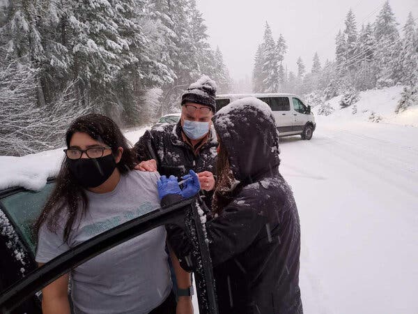 Health Workers, Stuck in the Snow, Administer Coronavirus
Vaccine to Stranded Drivers 1