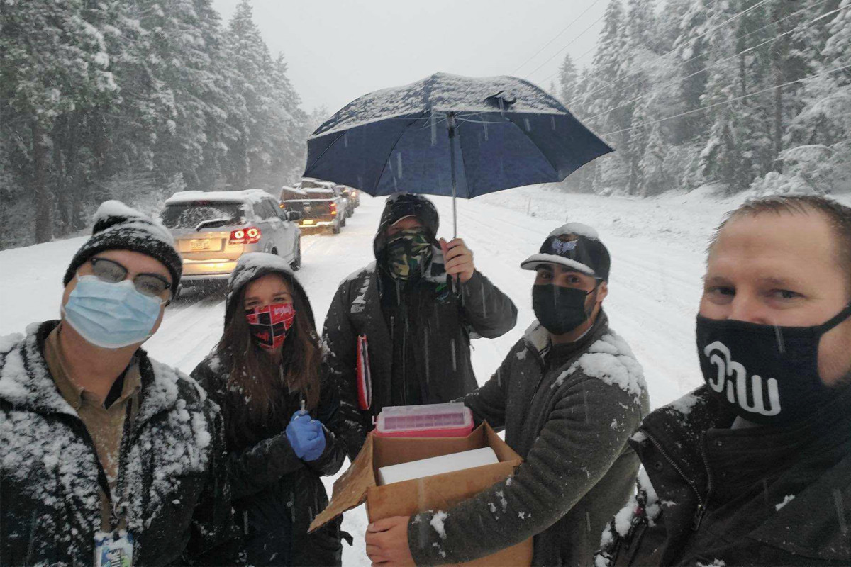 Health workers stuck in snowstorm go car-to-car giving
COVID-19 vaccine 1