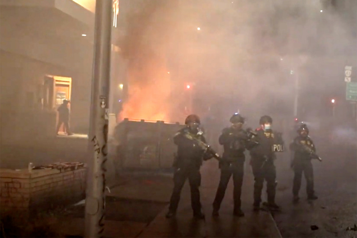 Portland protesters burn dumpster, hurl rocks at feds:
video 1