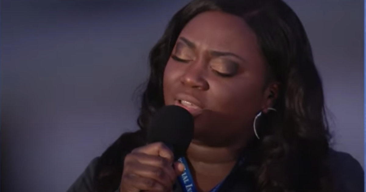 Frontline nurse performs "Amazing Grace" at COVID-19
memorial 1