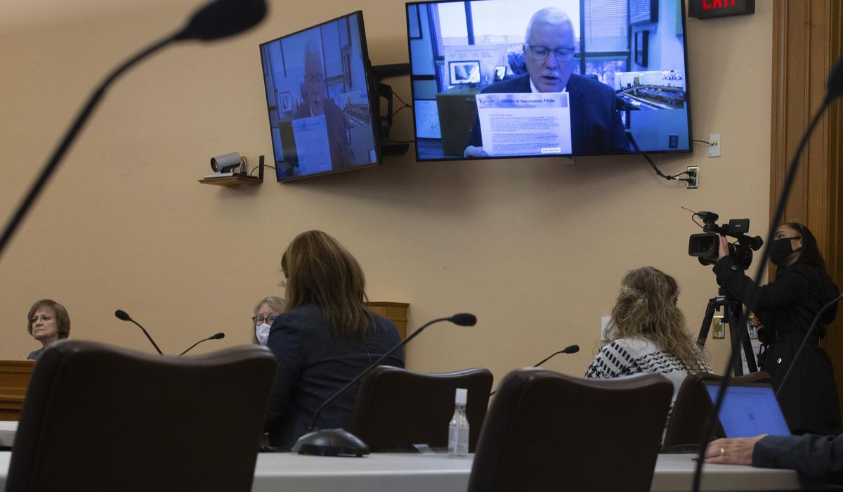 Kansas lawmakers' ire rises over handling of COVID-19
shots 1
