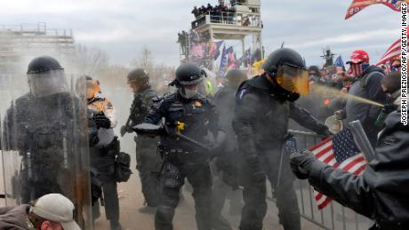 Prosecutors say retired NYPD officer beat officer with metal
pole during Capitol riot 1