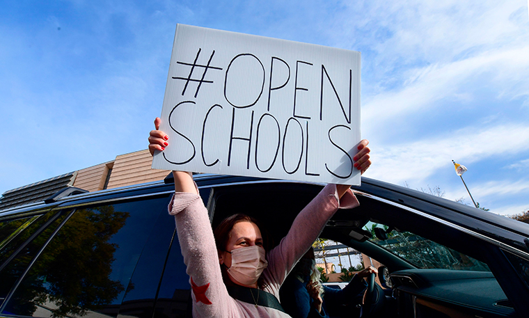 Schools can open at any stage of community spread of virus,
CDC director says 1