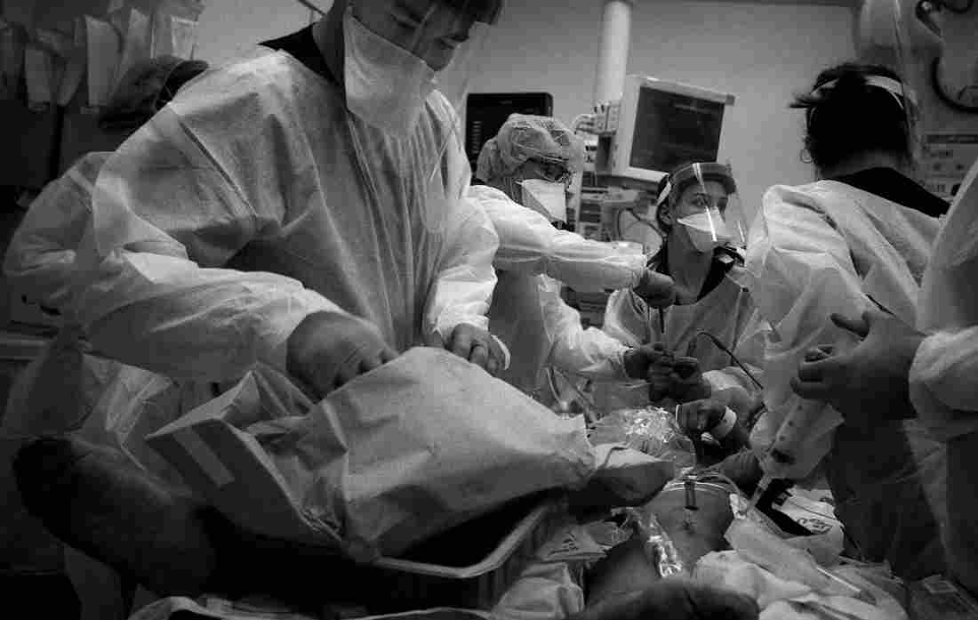 'The Essence Of Truth': A Doctor's Photos Document The
COVID-19 Crisis In The ER 1