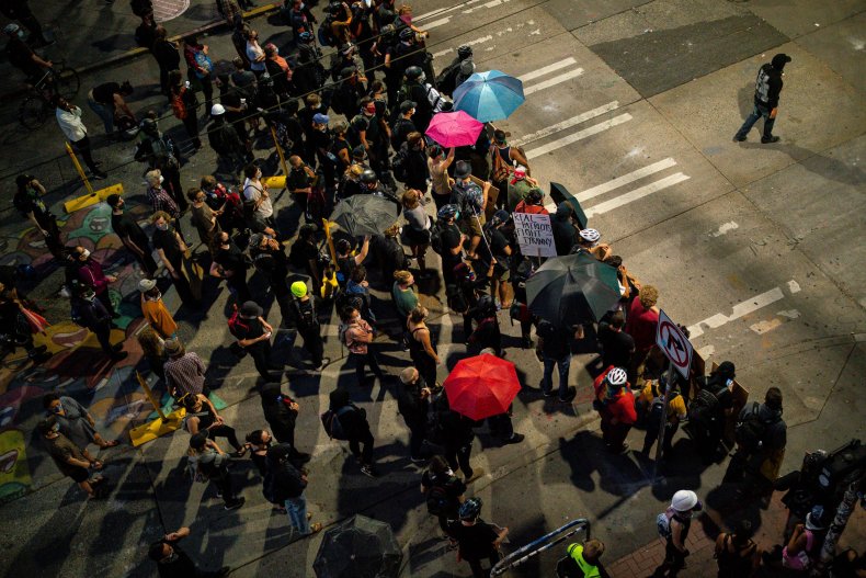 Video Shows Protesters Screaming 'Colonizer B****' at
Reporter After Police Fatally Shoot Man 1