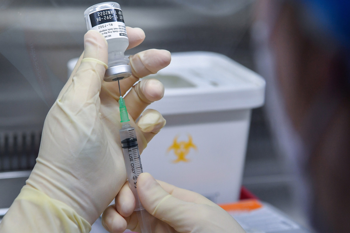 COVID-19 vaccine production ramps up as US hits daily
high 1