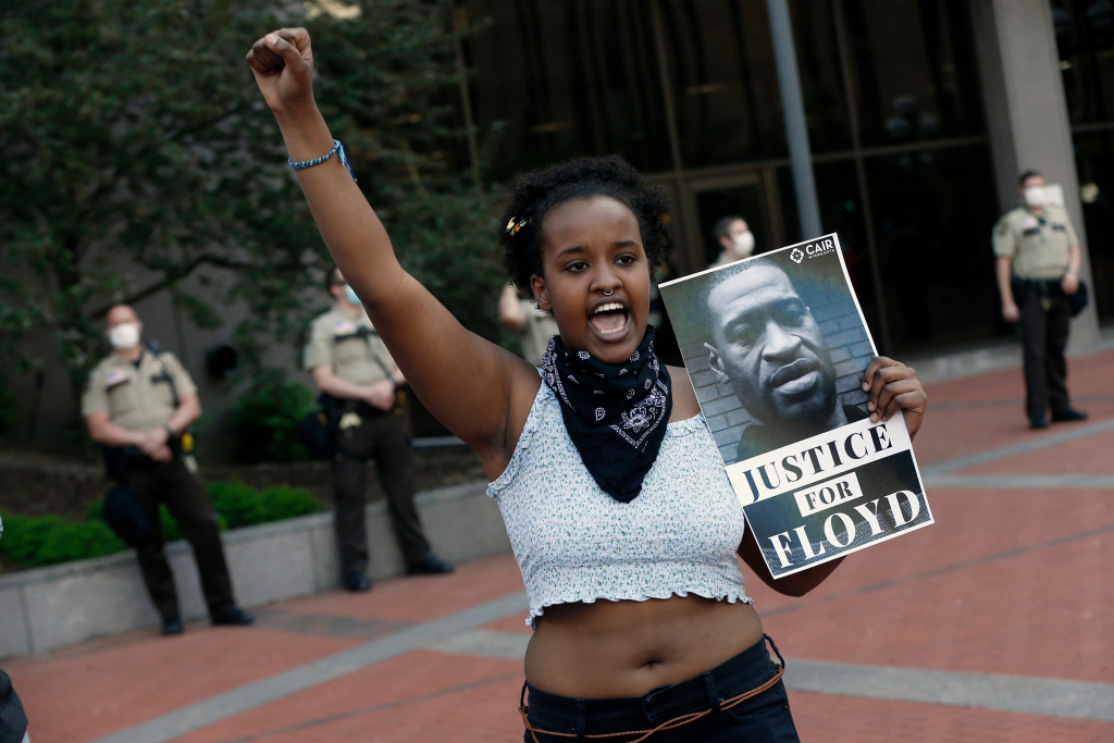 Dozens rally before ex-officer put on trial in Floyd’s
death 1