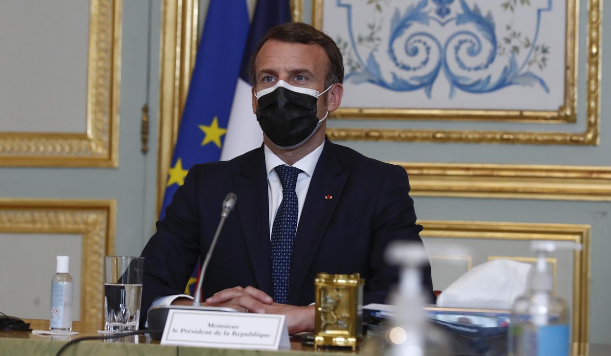 The Latest: France's Macron defends no-lockdown
policy 1