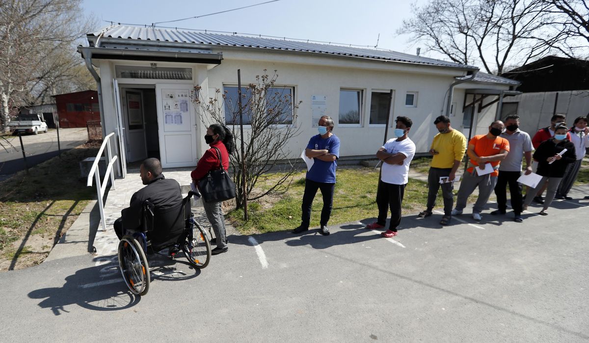 Serbia vaccinates migrants amid surge in COVID-19
cases 1