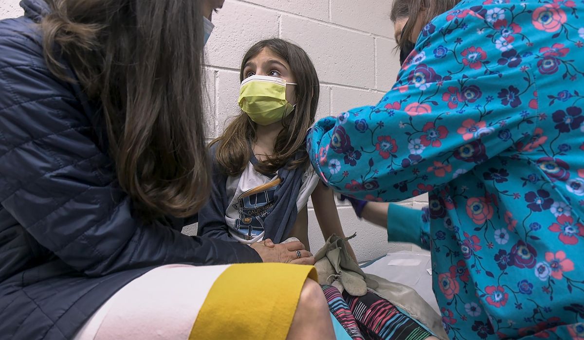 Shots in little arms: COVID-19 vaccine testing turns to
kids 1