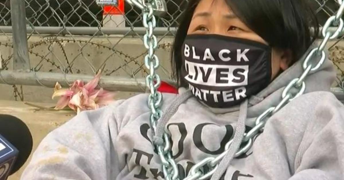 Protester chains herself to courthouse fence during Derek
Chauvin trial 1