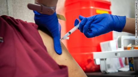 After you're vaccinated, it's critical to keep masking up in
many places (for now). Here's why 1