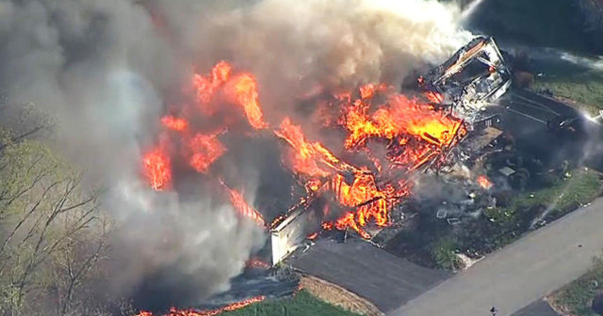Police officer shot and killed before New Hampshire house
explosion 1