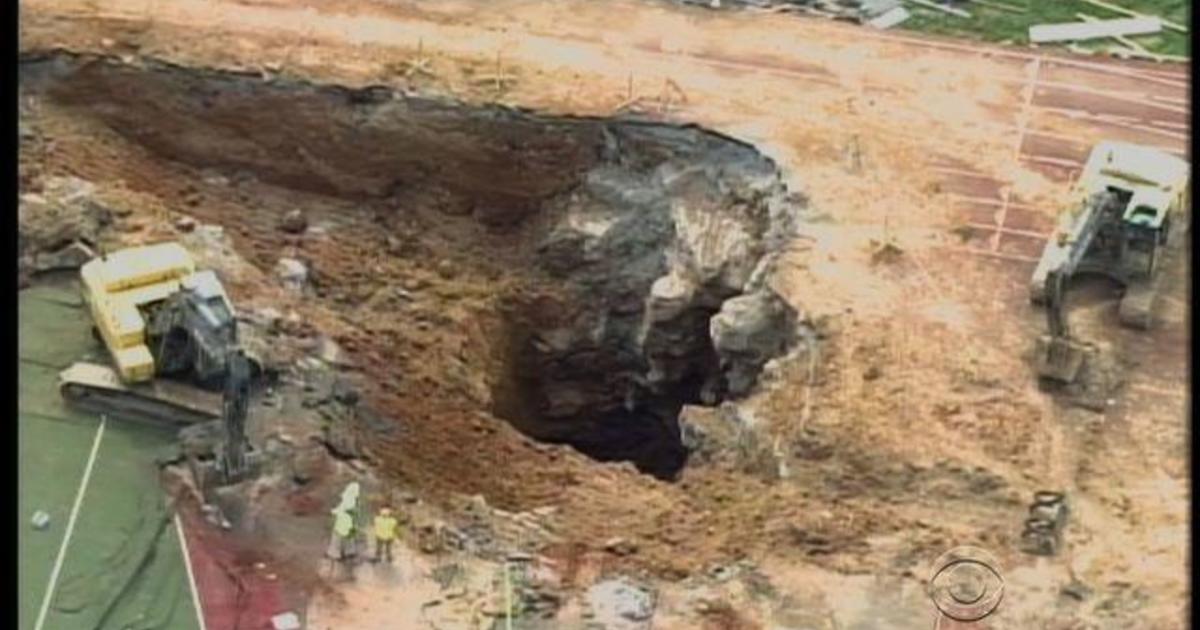 Sinkhole opens in endzone of Tennessee college football
stadium 1