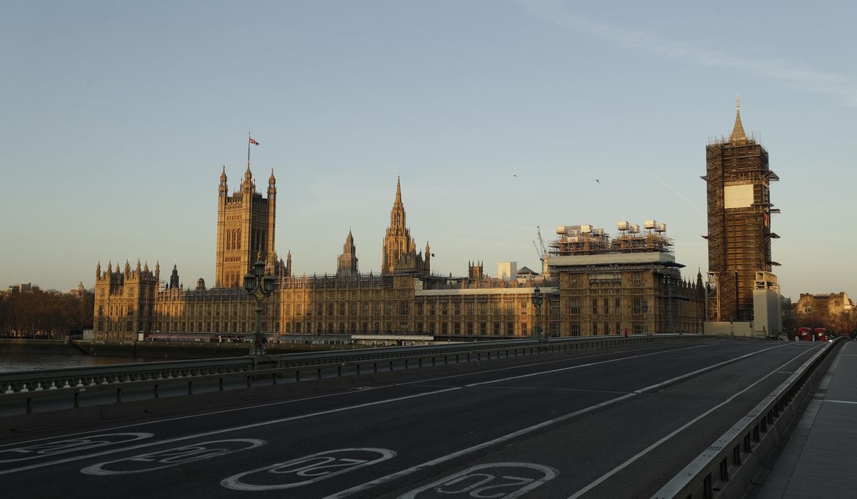 AP PHOTOS: UK reflects on death toll a year after
lockdown 1