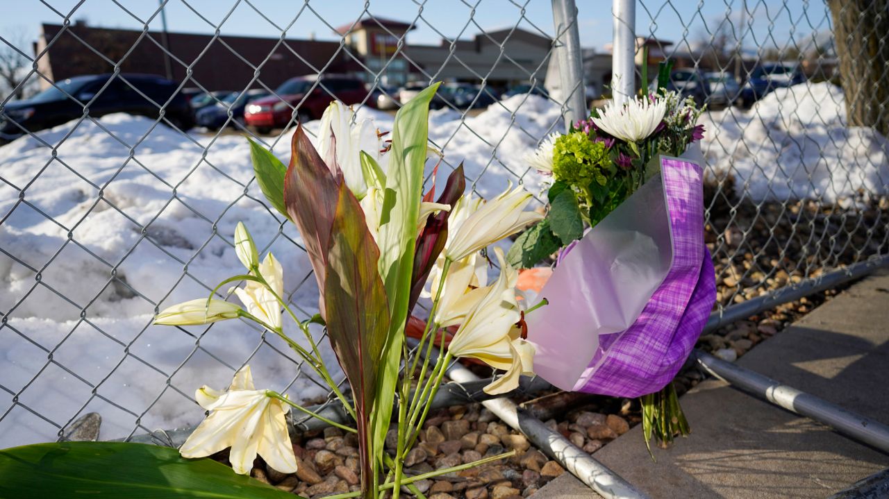 Colorado shooting victims included store workers,
officer 1