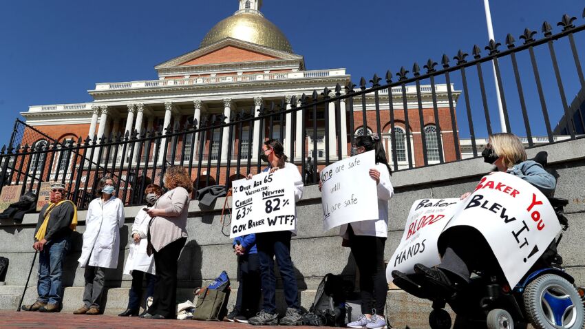 Local physicians blast Baker's COVID-19 vaccine rollout,
rally for equity outside State House 1