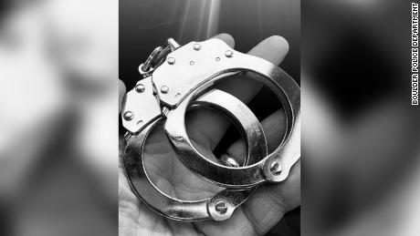 Police used slain officer's handcuffs to formally place
suspect in custody 1