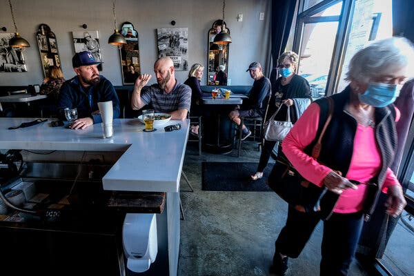 The Virus Spread Where Restaurants Reopened or Mask Mandates
Were Absent 1