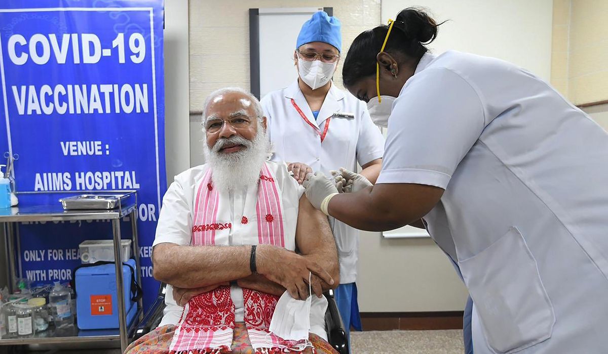India giving COVID-19 vaccines to more people as cases
rise 1