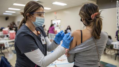 India hits 100 million vaccinations as Covid-19 cases surge
to record numbers 1