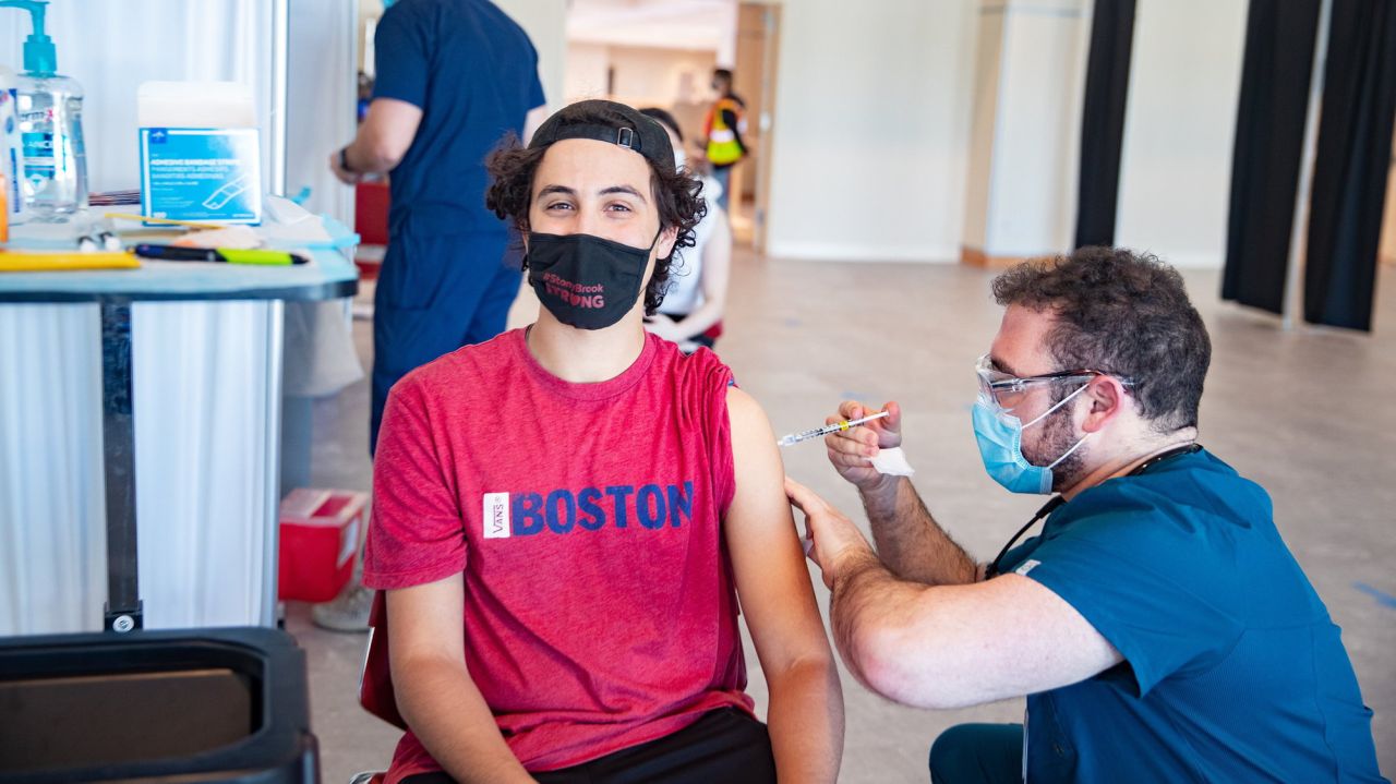 'Let's vaccinate them at the schools': New York's vaccine
push focusing on students 1