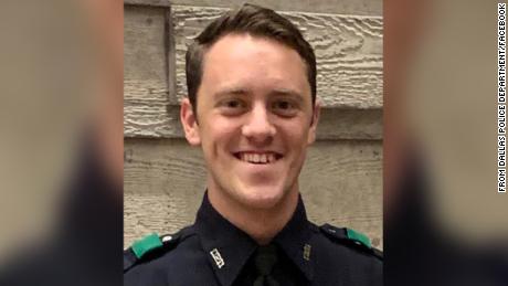 Man arrested after speeding off with a police officer's arm
trapped in truck window 1